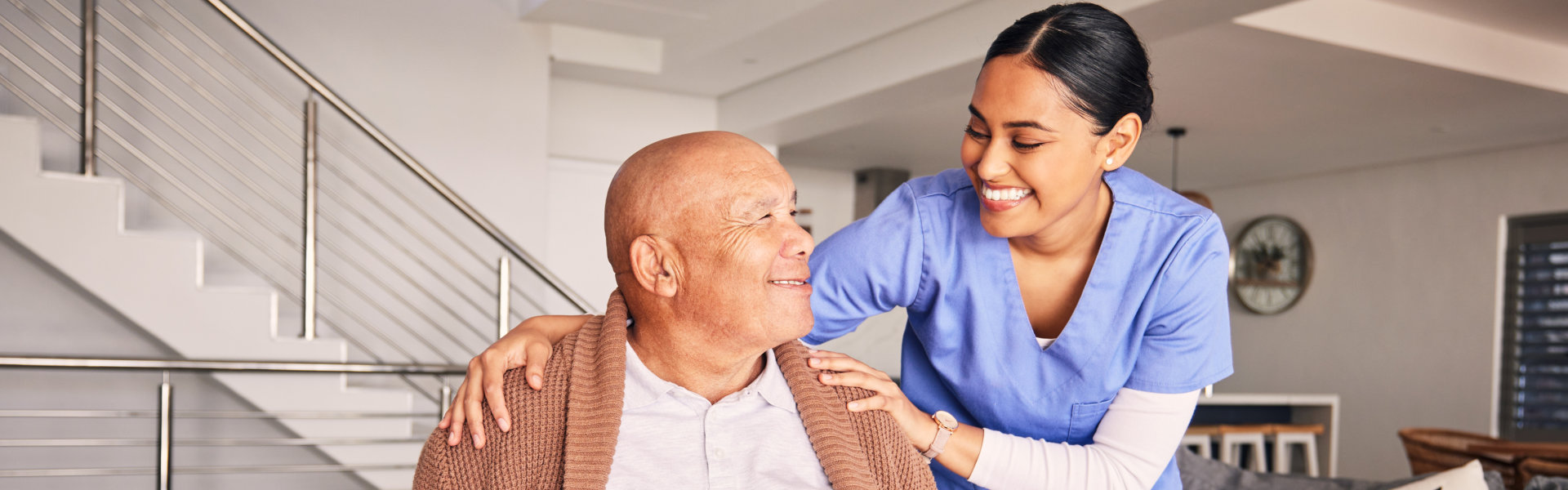 caregiver and elderly looking at each other